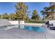 Back yard pool area with ample seating and green scenery at 916 Vegas Valley Dr, Las Vegas, NV 89109