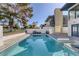 Back yard pool area with ample seating and green scenery at 916 Vegas Valley Dr, Las Vegas, NV 89109