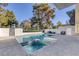 Back yard pool area with ample seating and green scenery at 916 Vegas Valley Dr, Las Vegas, NV 89109