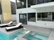 Outdoor patio with lounge chairs, hot tub, and sparkling pool for relaxation at 916 Vegas Valley Dr, Las Vegas, NV 89109