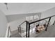 Modern staircase with sleek railings leading to an open floor plan with an adjacent dining area at 916 Vegas Valley Dr, Las Vegas, NV 89109