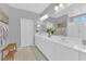 Bright bathroom featuring double sinks, white cabinets, and modern lighting at 9212 Lunar Effect St, Las Vegas, NV 89143
