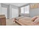 Serene bedroom with large window, closet and minimalist decor creating a calming atmosphere at 9212 Lunar Effect St, Las Vegas, NV 89143