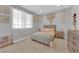 Charming bedroom with soft colors, a comfortable bed, and cozy decor at 9212 Lunar Effect St, Las Vegas, NV 89143