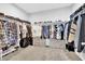 Large walk-in closet with ample storage, shelving, and rods at 9212 Lunar Effect St, Las Vegas, NV 89143