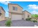 Charming two-story home with stucco siding, desert landscaping, and a two-car garage at 9212 Lunar Effect St, Las Vegas, NV 89143