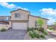 Charming two-story home with stucco siding, desert landscaping, and a two-car garage at 9212 Lunar Effect St, Las Vegas, NV 89143