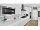 Close-up of modern kitchen with stainless steel appliances, and white countertops at 9212 Lunar Effect St, Las Vegas, NV 89143
