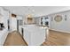 Modern kitchen with stainless steel appliances, large island, and pendant lighting at 9212 Lunar Effect St, Las Vegas, NV 89143