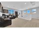 Spacious living room with comfortable seating and large windows providing natural light at 9212 Lunar Effect St, Las Vegas, NV 89143