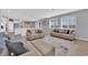 Open-concept living room with neutral color palette and lots of natural light at 9212 Lunar Effect St, Las Vegas, NV 89143