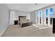 Bright main bedroom featuring neutral colors and a large door to a balcony at 9212 Lunar Effect St, Las Vegas, NV 89143