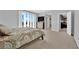 Spacious main bedroom with large windows and neutral carpeting at 9212 Lunar Effect St, Las Vegas, NV 89143