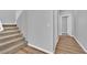 Carpeted staircase with a white banister leading upstairs at 9212 Lunar Effect St, Las Vegas, NV 89143