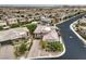 Aerial view of this residence in a planned community showing its brick paver driveway, landscaping, and tower detail at 9928 Regency Square Ave, Las Vegas, NV 89148