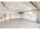 Spacious garage with epoxy flooring, built-in storage, overhead rack, and a bright window at 9928 Regency Square Ave, Las Vegas, NV 89148