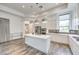 Modern kitchen featuring stainless steel appliances, white cabinetry, and a central island at 9928 Regency Square Ave, Las Vegas, NV 89148