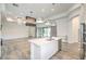 Bright open floorplan combining the kitchen and living room, perfect for entertaining at 9928 Regency Square Ave, Las Vegas, NV 89148