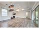 Bright and airy living room with tile flooring, contemporary lighting, and a fireplace at 9928 Regency Square Ave, Las Vegas, NV 89148