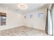 Minimalist living room featuring tile flooring, recessed lighting, and an outdoor view at 9928 Regency Square Ave, Las Vegas, NV 89148