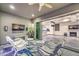 Stylish outdoor living area offering an outdoor kitchen and seamless indoor-outdoor flow with inviting seating and decor at 9928 Regency Square Ave, Las Vegas, NV 89148