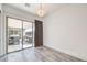 View of a bright and airy room with an outdoor kitchen area visible through sliding glass doors at 9928 Regency Square Ave, Las Vegas, NV 89148