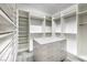 Spacious walk-in closet with custom shelving, drawers, and ample storage space at 9928 Regency Square Ave, Las Vegas, NV 89148
