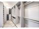 Custom walk-in closet with ample shelving and drawers for optimal storage organization at 9928 Regency Square Ave, Las Vegas, NV 89148