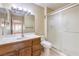 Bathroom features a shower stall, white vanity, and updated mirror at 9948 Bundella Dr, Las Vegas, NV 89134