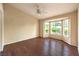 The primary bedroom offers a large bay window and wood flooring at 9948 Bundella Dr, Las Vegas, NV 89134