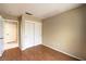 Secondary bedroom boasts neutral walls, wood flooring, and an attached closet at 9948 Bundella Dr, Las Vegas, NV 89134