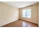 Cozy bedroom features wood floors and a large picture window at 9948 Bundella Dr, Las Vegas, NV 89134
