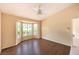 This bright bedroom features wood flooring and a large window at 9948 Bundella Dr, Las Vegas, NV 89134