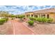 Attractive single-story home with terracotta tile roof surrounded by a well maintained landscape at 9948 Bundella Dr, Las Vegas, NV 89134