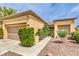 Well-kept single-story home featuring a desert landscape and two-car garage at 9948 Bundella Dr, Las Vegas, NV 89134