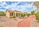 Charming single-story home with a terracotta tile roof and neatly landscaped front yard with stone mulch at 9948 Bundella Dr, Las Vegas, NV 89134