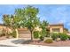Inviting single-story home with a well-manicured front yard and attached two-car garage at 9948 Bundella Dr, Las Vegas, NV 89134
