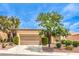 Charming one-story home with a well-maintained front yard and an attached two-car garage at 9948 Bundella Dr, Las Vegas, NV 89134