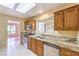 Bright kitchen with stainless steel appliances, granite countertops, and a garden window at 9948 Bundella Dr, Las Vegas, NV 89134