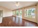 Open-concept living space with wood floors, recessed lighting, and large windows overlooking the backyard at 9948 Bundella Dr, Las Vegas, NV 89134