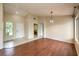 Bright living room with hardwood floors, neutral walls, and large windows providing ample natural light at 9948 Bundella Dr, Las Vegas, NV 89134