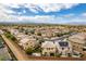 Aerial view of the neighborhood, showcasing the community, and homes in a suburban setting with views of distant mountains at 1417 Brushback Ave, Henderson, NV 89074