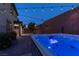 Enjoy the evening in this backyard hot tub with overhead string lights enhancing the atmosphere at 1417 Brushback Ave, Henderson, NV 89074