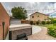 Fully fenced backyard with mature landscaping, storage shed, and a Viking hot tub at 1417 Brushback Ave, Henderson, NV 89074
