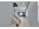 Entryway with staircase featuring neutral tile flooring, light blue walls, and a view into the open living area at 1417 Brushback Ave, Henderson, NV 89074