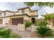 Charming two-story home featuring desert landscaping, a two-car garage, and a gated front entry in a suburban neighborhood at 1417 Brushback Ave, Henderson, NV 89074