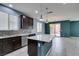 Open kitchen featuring an island, stainless steel appliances, and access to the backyard at 1417 Brushback Ave, Henderson, NV 89074