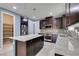 Bright kitchen featuring stainless appliances, granite countertops, and a convenient pantry at 1417 Brushback Ave, Henderson, NV 89074