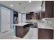 Contemporary kitchen with stainless steel appliances, granite countertops, and ample cabinetry at 1417 Brushback Ave, Henderson, NV 89074