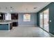 Open living space with tile floors, recessed lighting, and easy access to the outdoor patio at 1417 Brushback Ave, Henderson, NV 89074